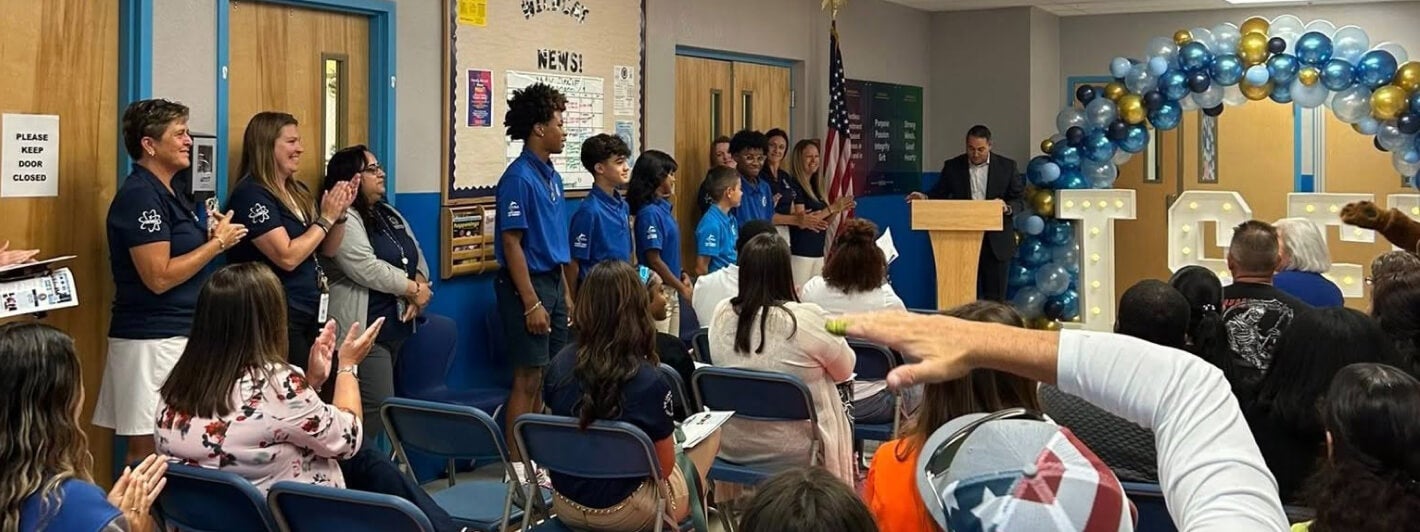 Interior photo of a classroom where Devoe is hosting an event for its Scholarship students.