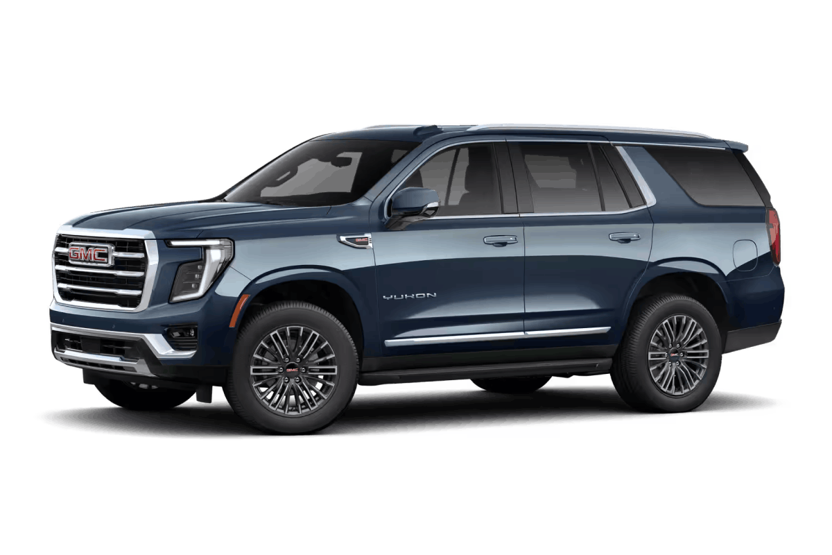 Blue GMC Yukon SUV, front three-quarter view.