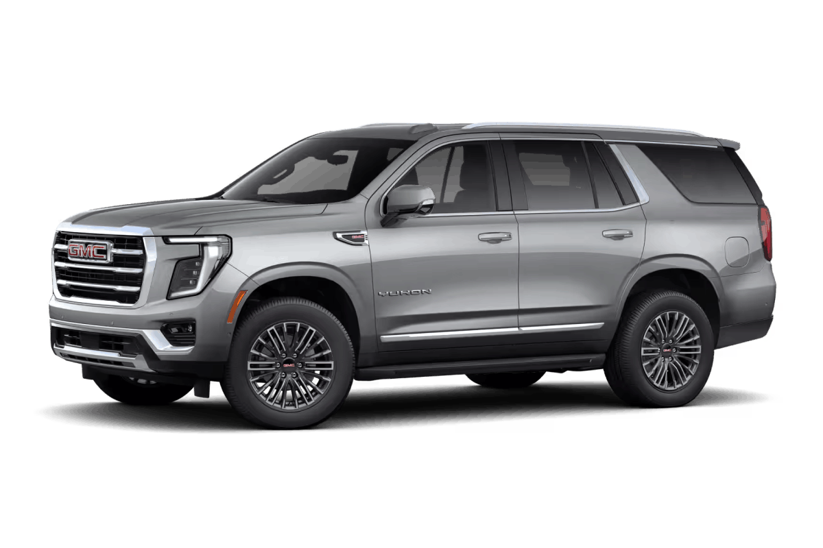 Silver GMC Yukon SUV, front three-quarter view.